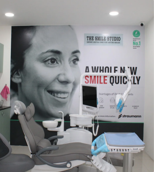 The Smile Studio modern dental treatment room with branding wall